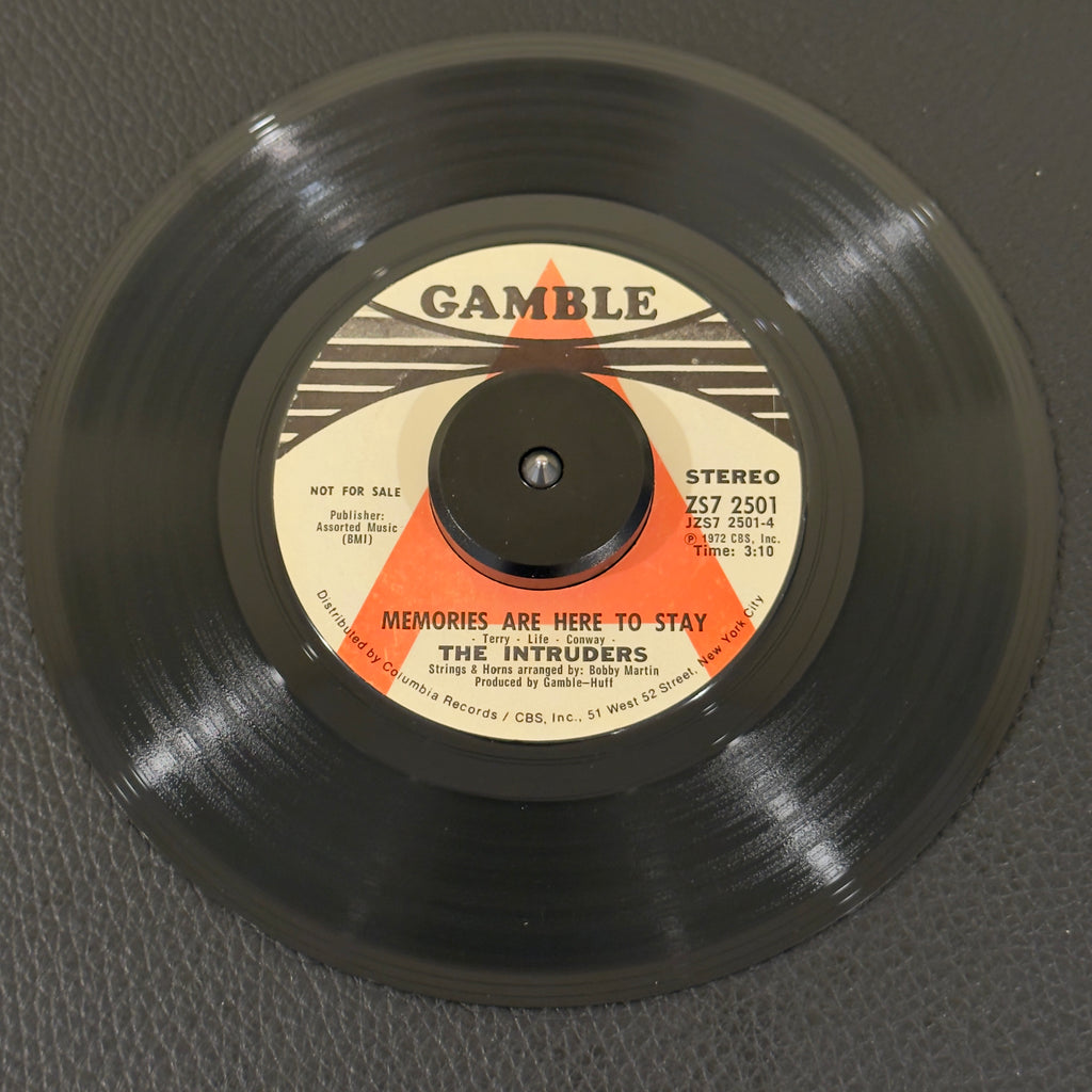 7" vinyl record by Intruders, The featuring "Memories Are Here To Stay/(Win, Place Or Show) She's A Winner", released on Gamble (ZS7 2501), in VG+ (Very Good Plus) condition, classic analog collectable for turntable playback. Exceptional promo copy of 1972 Philadelphia soul.