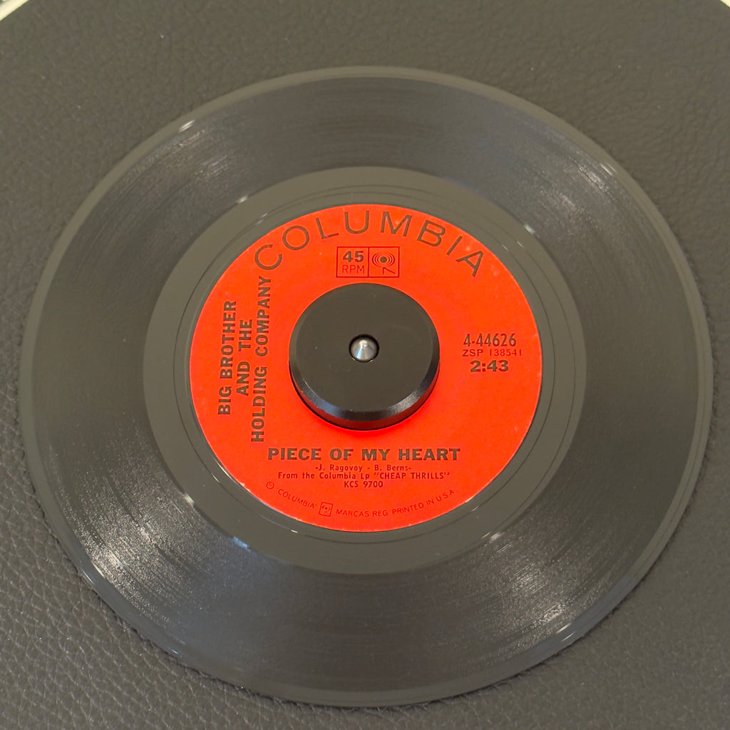 7" vinyl record by Big Brothers And The Holding Company featuring "Piece Of My Heart/Turtle Blues", released on Columbia (4-44626), in NM (Near Mint) condition, classic analog collectable for turntable playback. 1968 single featuring Janis Joplin’s earth-shattering performance on "Piece of My Heart," backed with the raw acoustic blues track "Turtle Blues." Original Columbia sleeve.