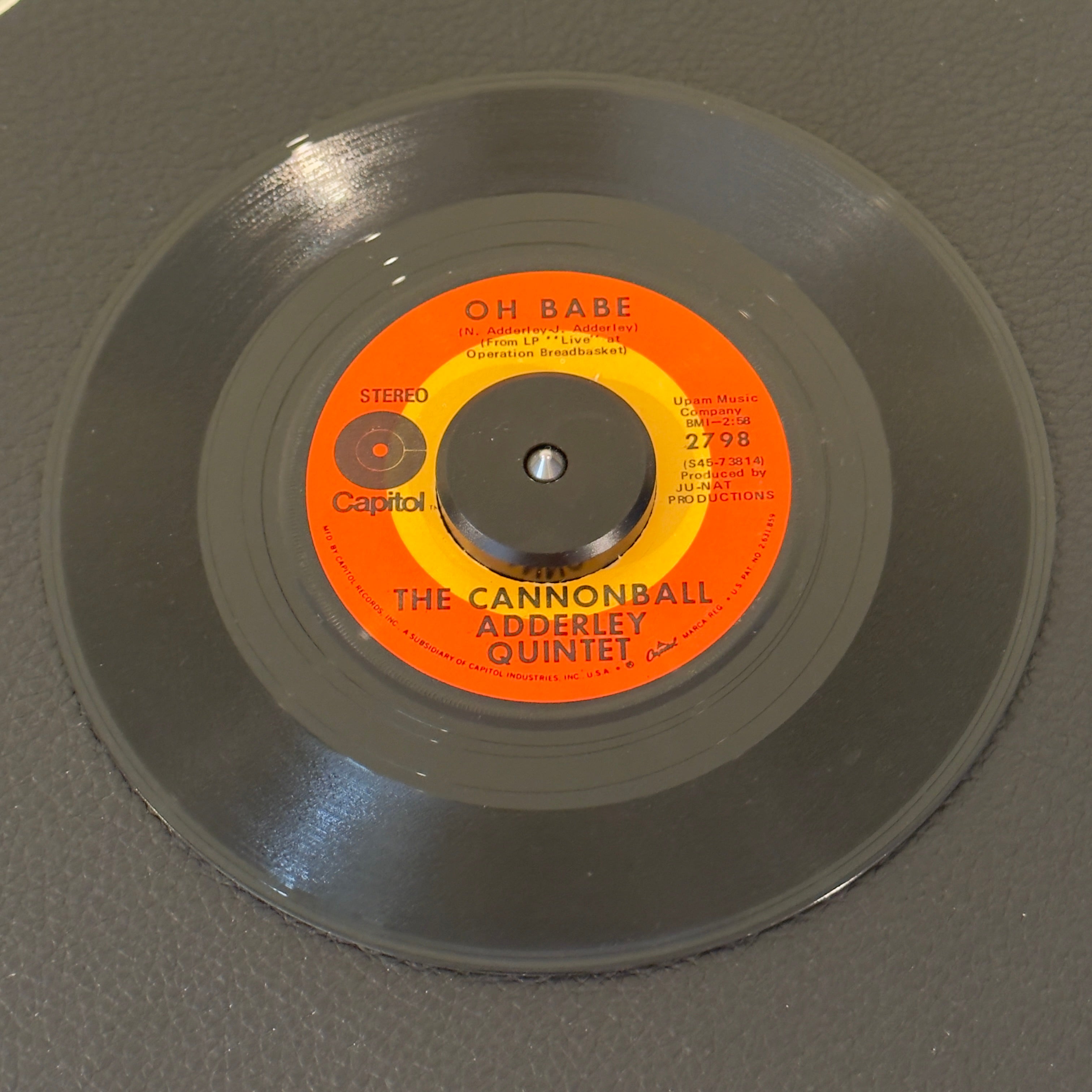 7" vinyl record by Cannonball Adderley Quintet featuring "Oh Babe/Marabi", released on Capitol Records (2798), in VG (Very Good) condition, classic analog collectable for turntable playback. 1969 soul-jazz groove captures the legendary lineup at the absolute peak of their late-60s funky jazz fusion era. Original sleeve.