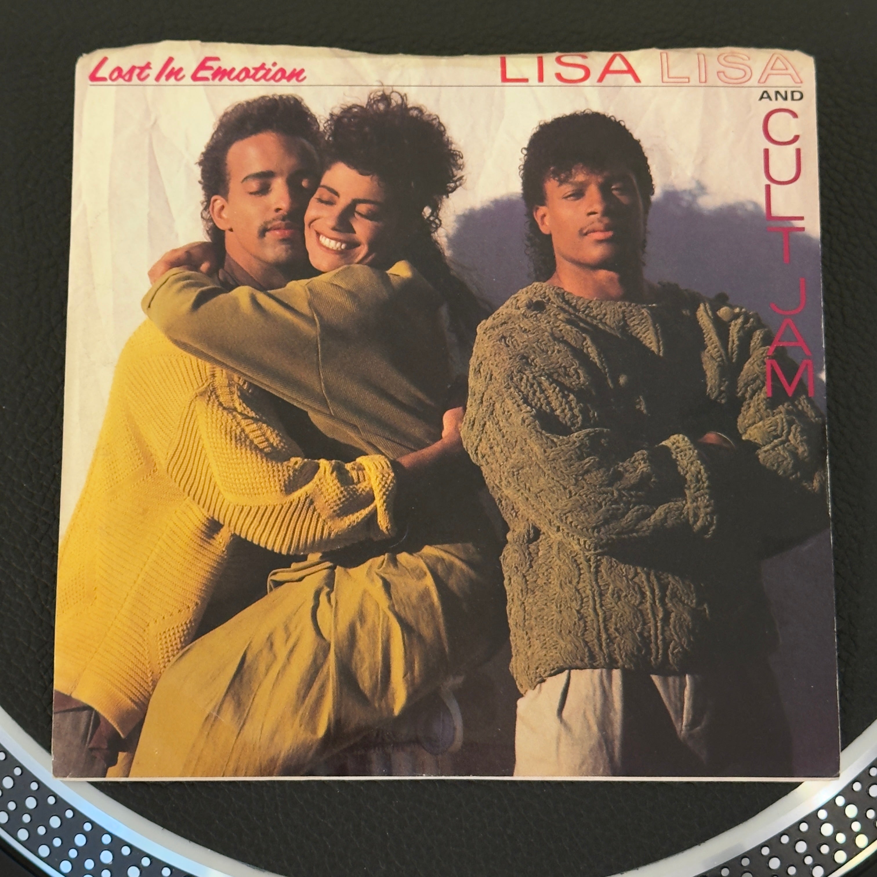 7" vinyl record by Lisa Lisa and The Cult Jam featuring "Lost In Emotion/Motion Is Lost", released on Columbia (38-07267), in VG+ (Very Good Plus) condition, classic analog collectable for turntable playback. 1987 single features Lisa Lisa and Cult Jam performing their iconic, Billboard Billboard Hot 100 #1 hit "Lost In Emotion." Pic sleeve included.