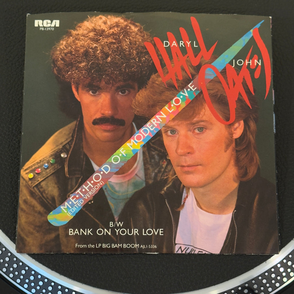 7" vinyl record by Daryl Hall & John Oates featuring "Method Of Modern Love/Bank On Your Love", released on RCA (PB-13970), in NM (Near Mint) condition, classic analog collectable for turntable playback. One of the most successful duos in rock history perform their massive 1974 Billboard Hot 100 Top 5 hit. Pic sleeve inc.