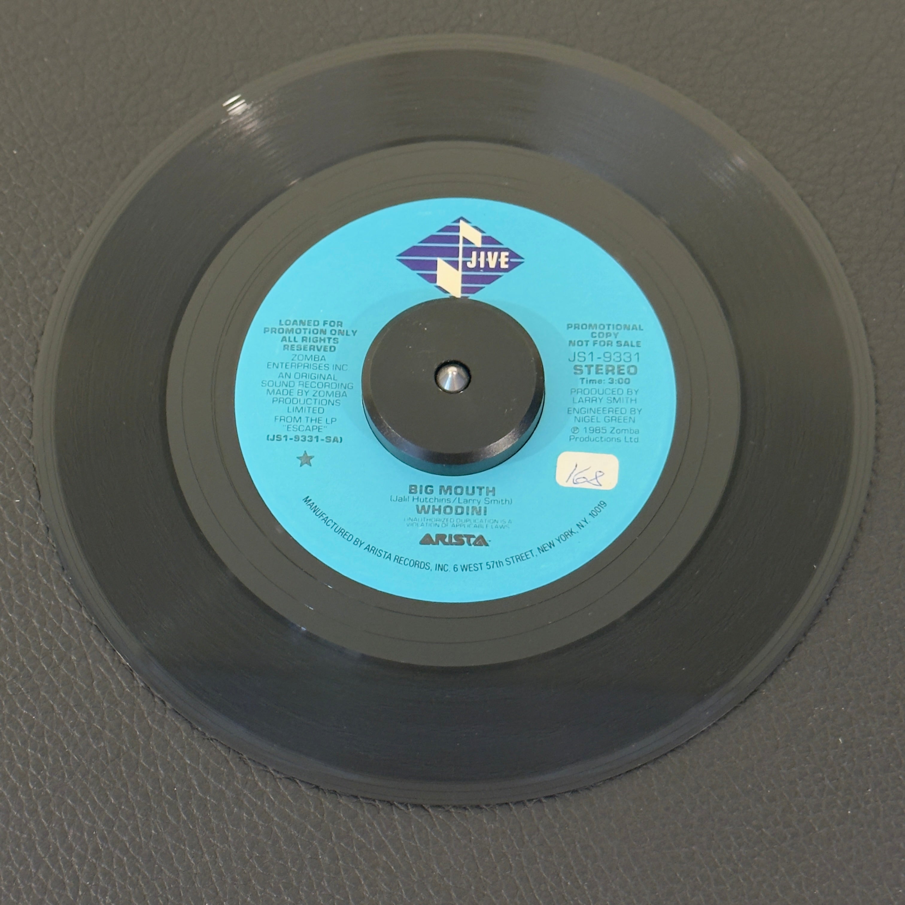 7" vinyl record by Whodini featuring "Big Mouth/Big Mouth", released on Jive (JS1-9331), in VG+ (Very Good Plus) condition, classic analog collectable for turntable playback. Promo copy of this 1985 banger famous for its sharp lyricism, punchy early beatbox cadences, and heavy electronic synthesizer lines, this track is an absolute milestone of 1980s East Coast rap music.