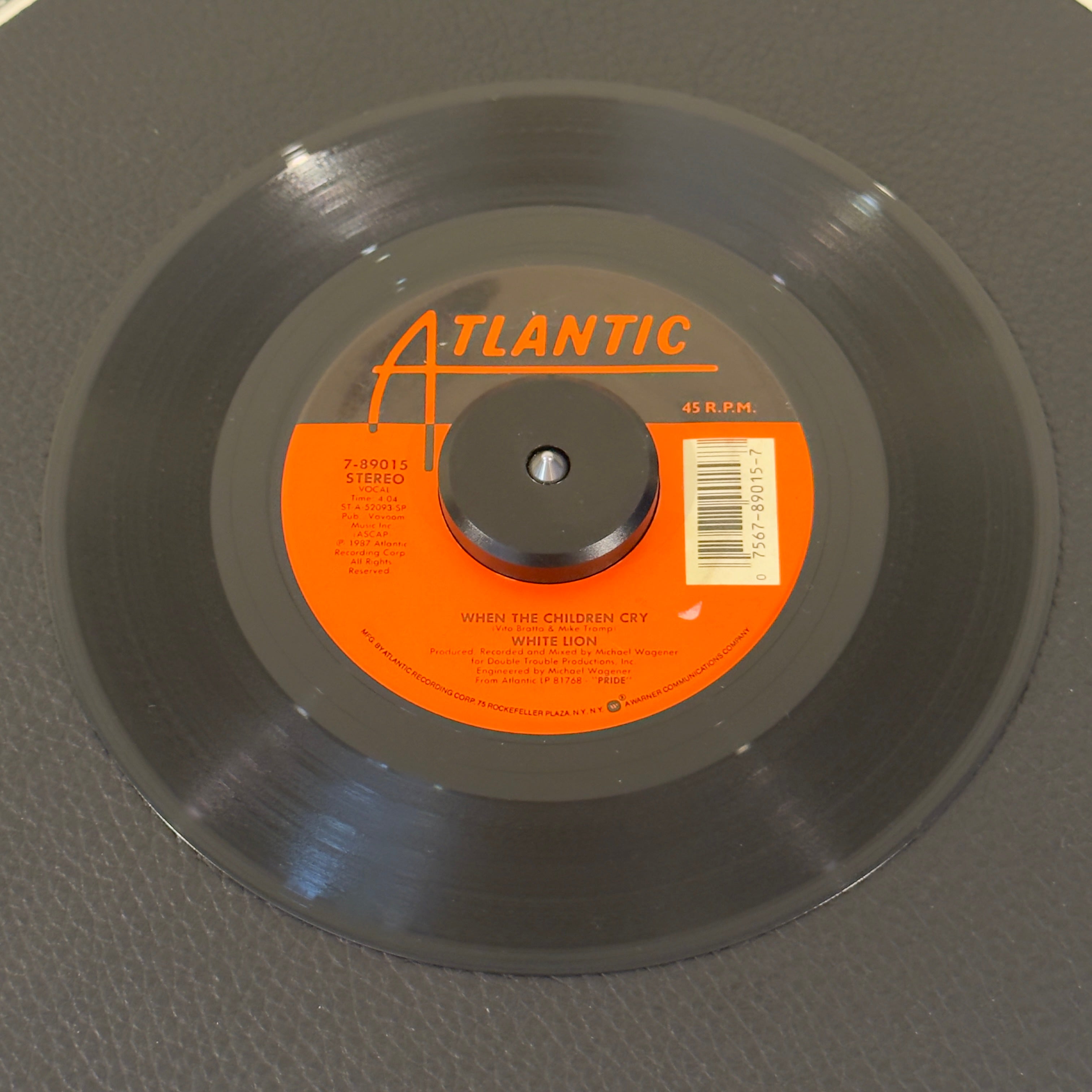 7" vinyl record by White Lion featuring "When The Children Cry/Lady Of The Valley", released on Atlantic (7-89015), in NM (Near Mint) condition, classic analog collectable for turntable playback. Relive the peak of '80s power ballads with this single of White Lion’s iconic hit!  Atlantic sleeve included.