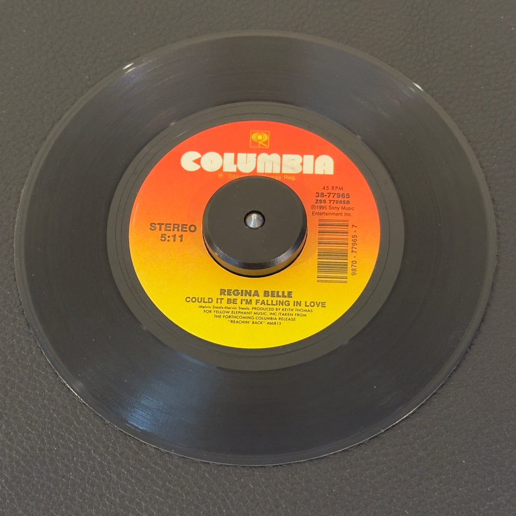 7" vinyl record by Regina Belle featuring "Could It Be I'm Falling In Love/Love T.K.O.", released on Columbia (38-77965), in NM (Near Mint) condition, classic analog collectable for turntable playback. The ultimate double-sider. A-side features her stunning interpretation of The Spinners' classic while the B-side serves up her incredibly smooth, late-night cover of Teddy Pendergrass.