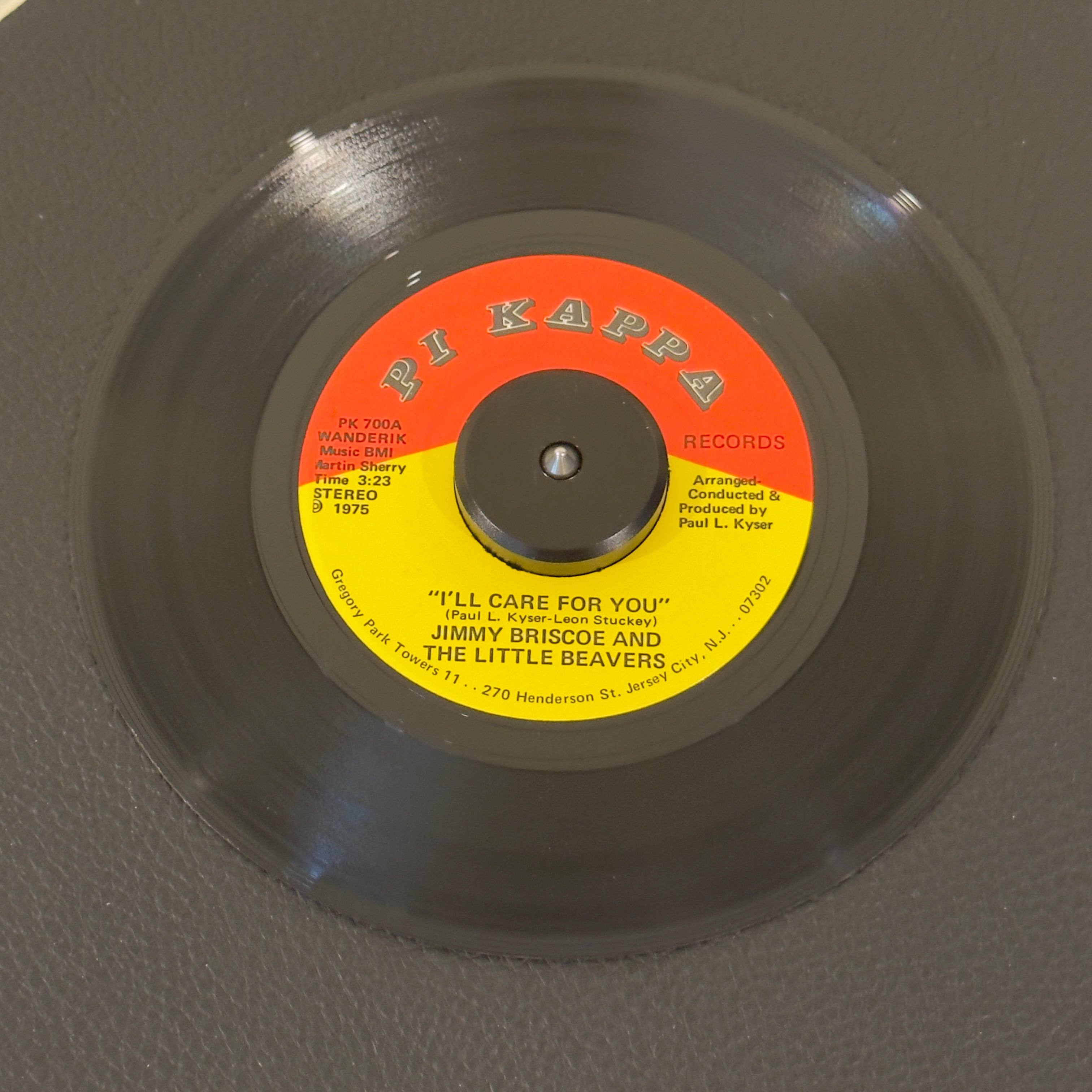7" vinyl record by Jimmy Brisco & The Little Beavers featuring "I'll Care For You/Movin' On", released on Pi Kappa Records (PK 700), in NM (Near Mint) condition, classic analog collectable for turntable playback. Produced by the great Paul Kyser, this single perfectly captures the group's lush vocal harmonies on the A-side ballad, backed by a driving disco-funk groove on the flip side.