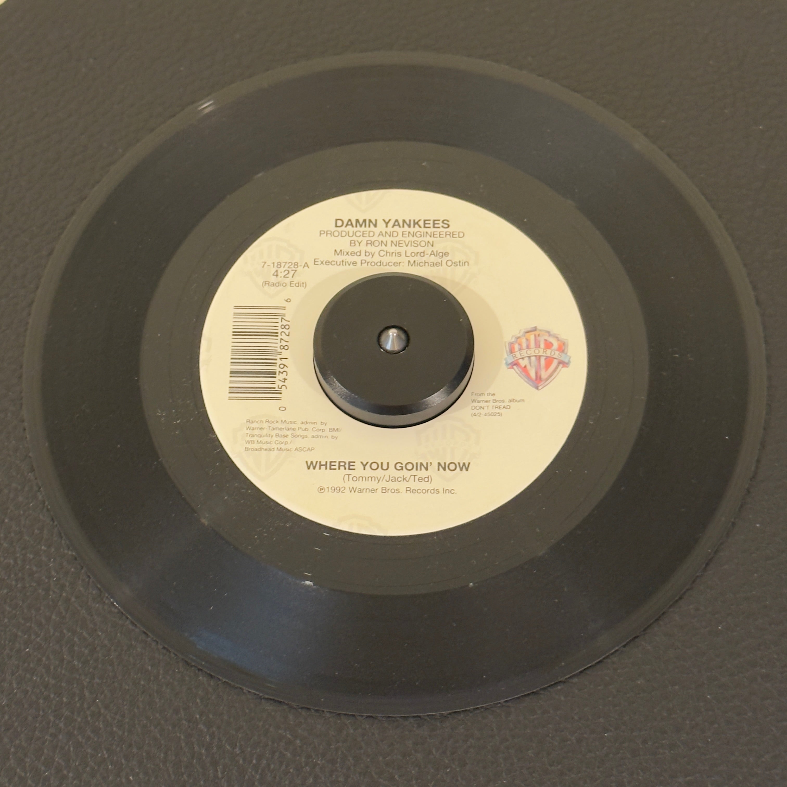 7" vinyl record by Damn Yankees featuring "Where You Goin' Now (Radio Edit)/This Side Of Hell (Album Version)", released on Warner Bros. Records (7-18728), in NM (Near Mint) condition, classic analog collectable for turntable playback. US pressing featuring the stellar supergroup combination of Tommy Shaw, Jack Blades, and Ted Nugent at their melodic best.