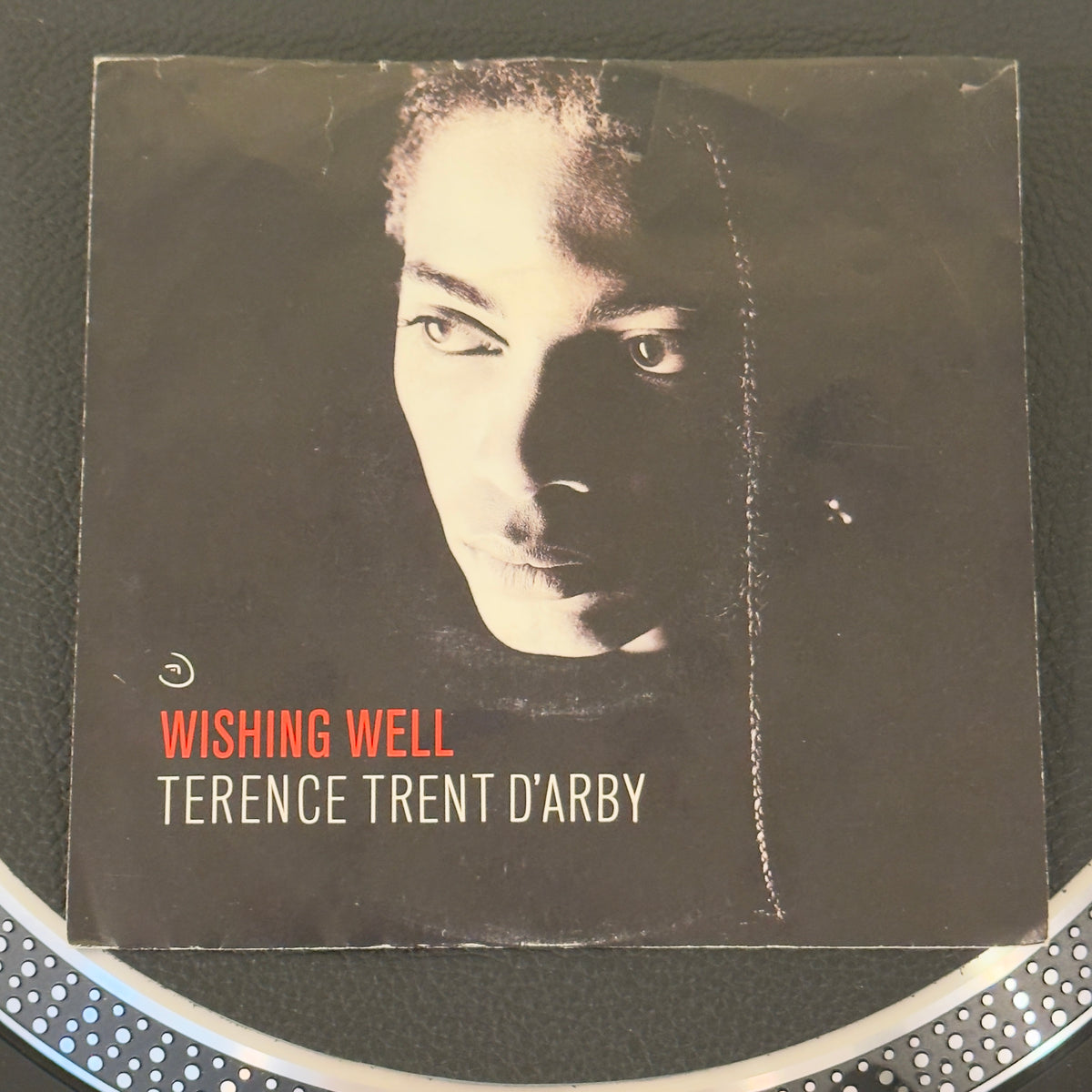 7" vinyl record by Terence Trent D'Arby featuring "Wishing Well/Elevators & Hearts", released on Columbia (38-07675), in VG+ (Very Good Plus) condition, classic analog collectable for turntable playback. Classic slice of late '80s pop/soul royalty: Terence Trent D’Arby’s smash hit "Wishing Well" with its pic sleeve. WOL