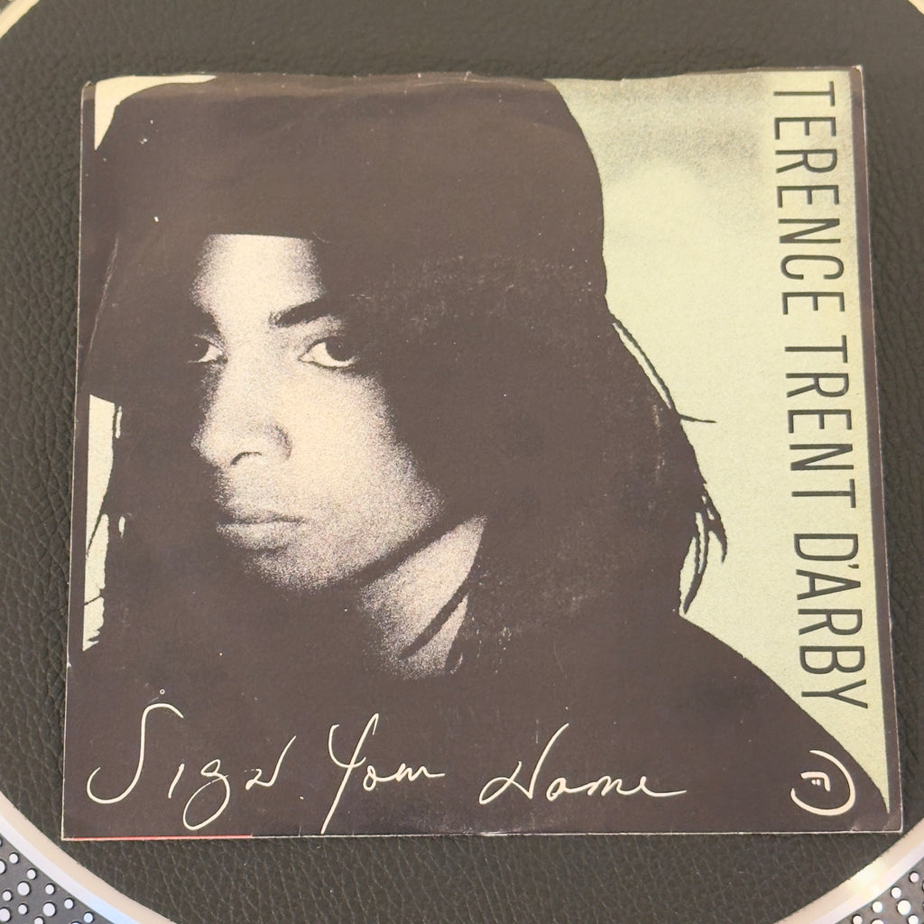 7" vinyl record by Terence Trent D'Arby featuring "Sign Your Name/Greasy Chicken", released on Columbia (38-07911), in NM (Near Mint) condition, classic analog collectable for turntable playback. Beautiful, top-tier copy of the soulful 1987 masterpiece in it's original pic sleeve. WOL