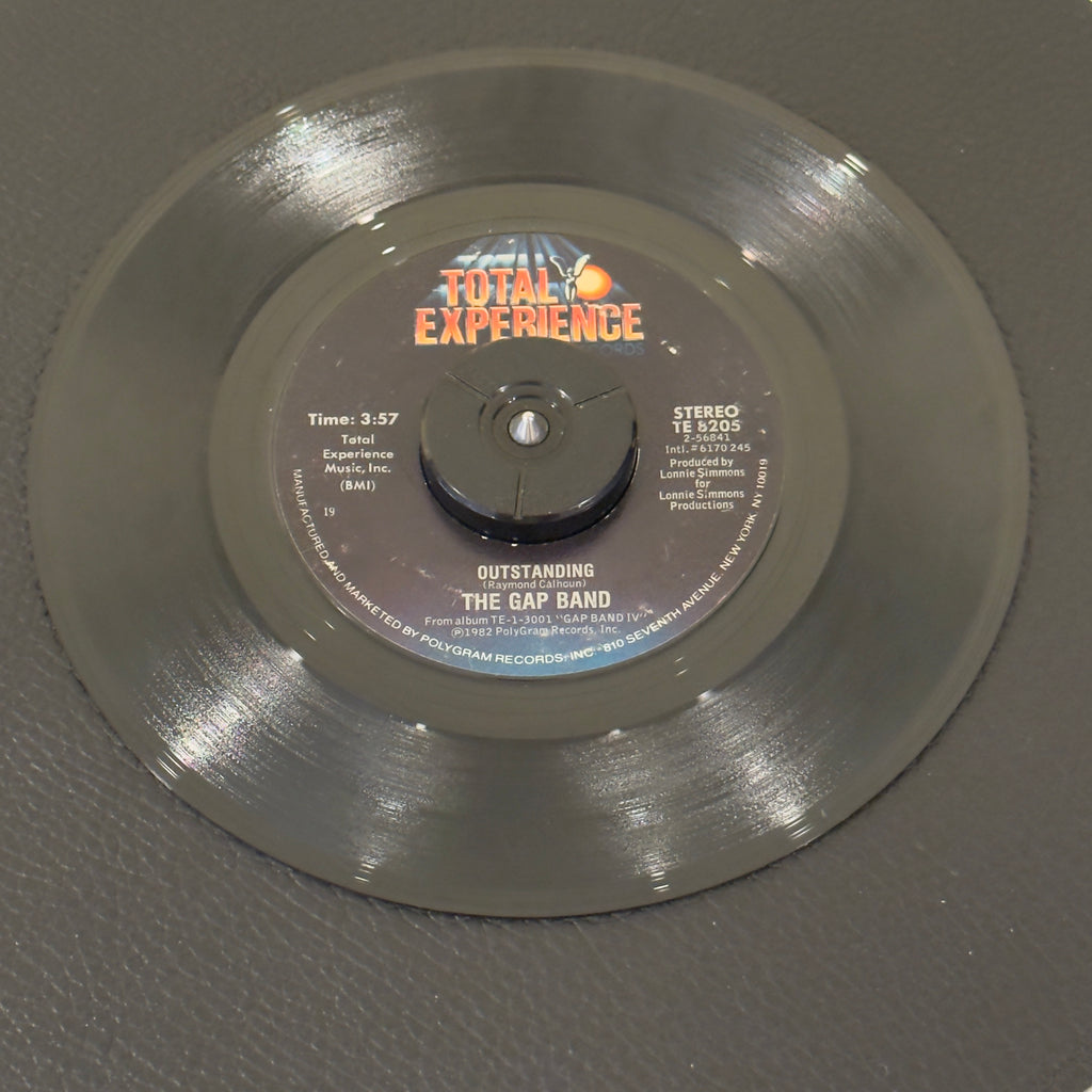 7" vinyl record by Gap Band, The featuring "Outstanding/The Boys Are Back In Town", released on Total Experience Records (TE 8205), in VG (Very Good) condition, classic analog collectable for turntable playback. Bestway Products Pressing (19)