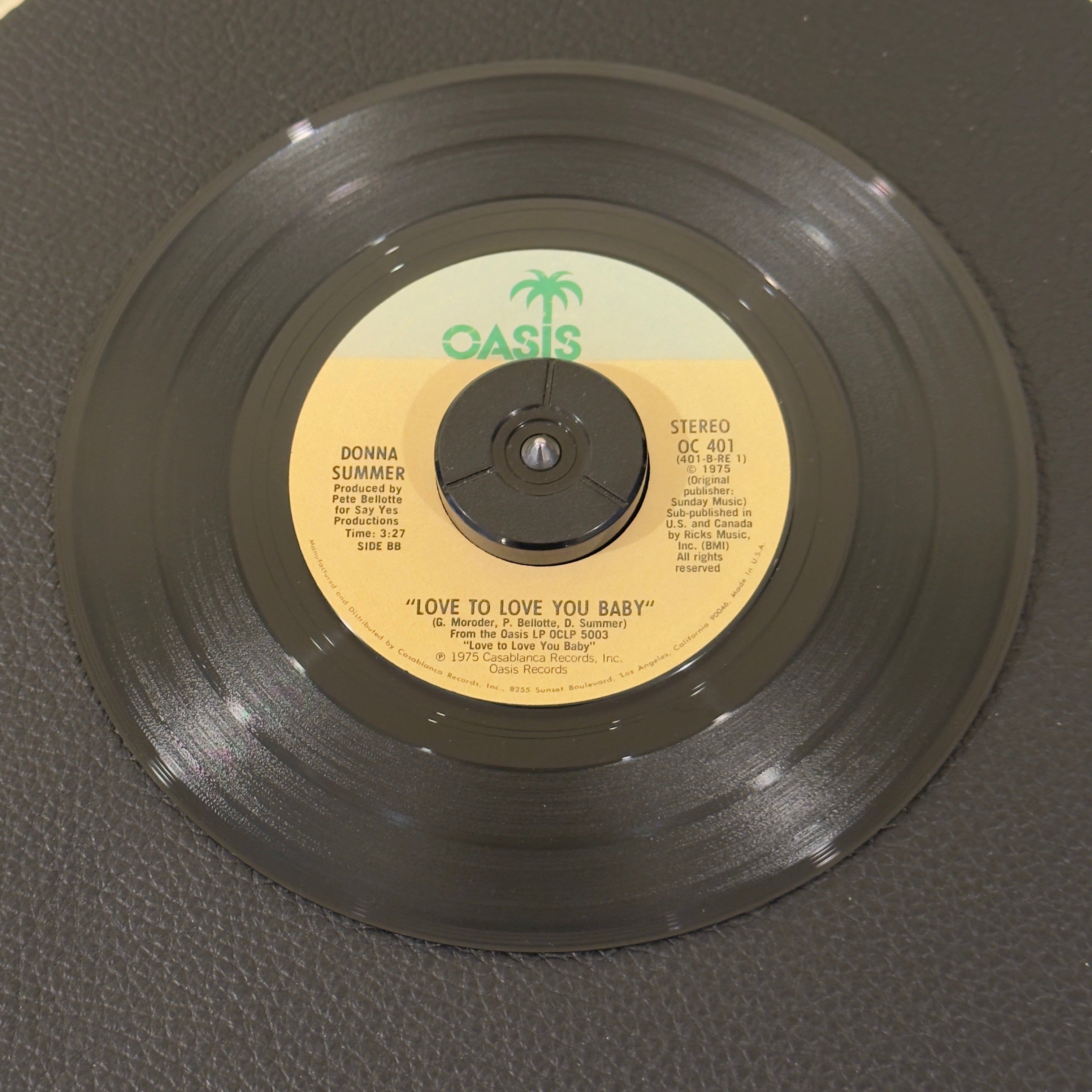 7" vinyl record by Donna Summer featuring "Love To Love You Baby/Love To Love You Baby", released on Oasis (OC 401), in VG+ (Very Good Plus) condition, classic analog collectable for turntable playback. Label Variation - timing on left side of label.