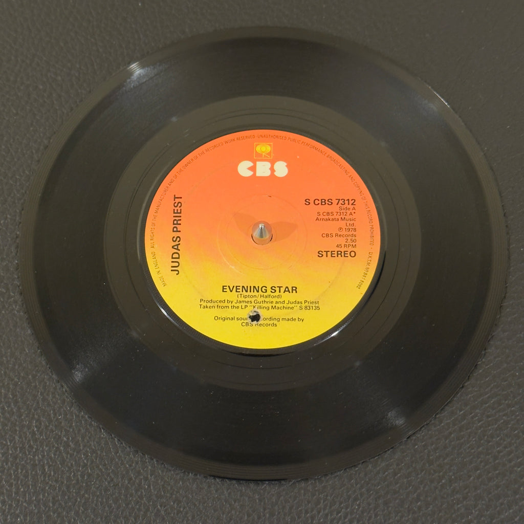 7" vinyl record by Judas Priest featuring "Evening Star/Beyond The Realms of Death", released on CBS (S CBS 7312), in VG (Very Good) condition, classic analog collectable for turntable playback. UK Pressing. Punch hole in label.