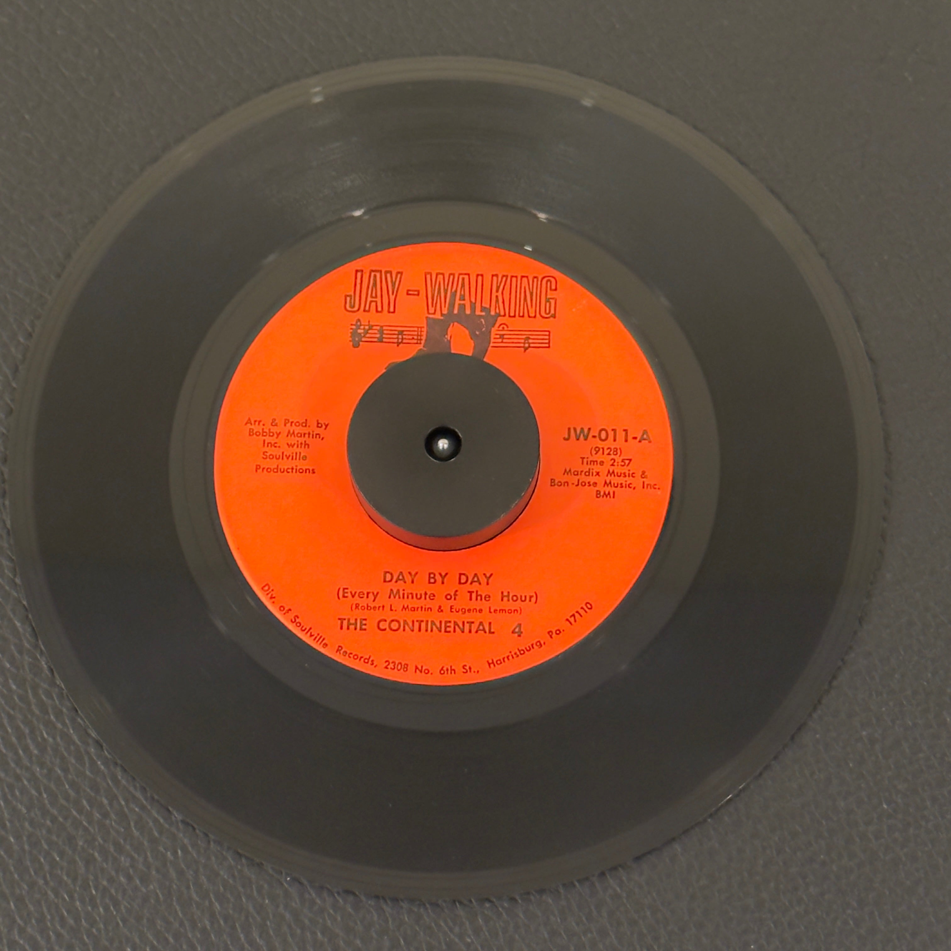 7" vinyl record by Continental 4, The featuring "Day By Day (Every Minute Of The Hour)/What Gave You Up", released on Jay-Walking (JW-011), in VG+ (Very Good Plus) condition, classic analog collectable for turntable playback.
