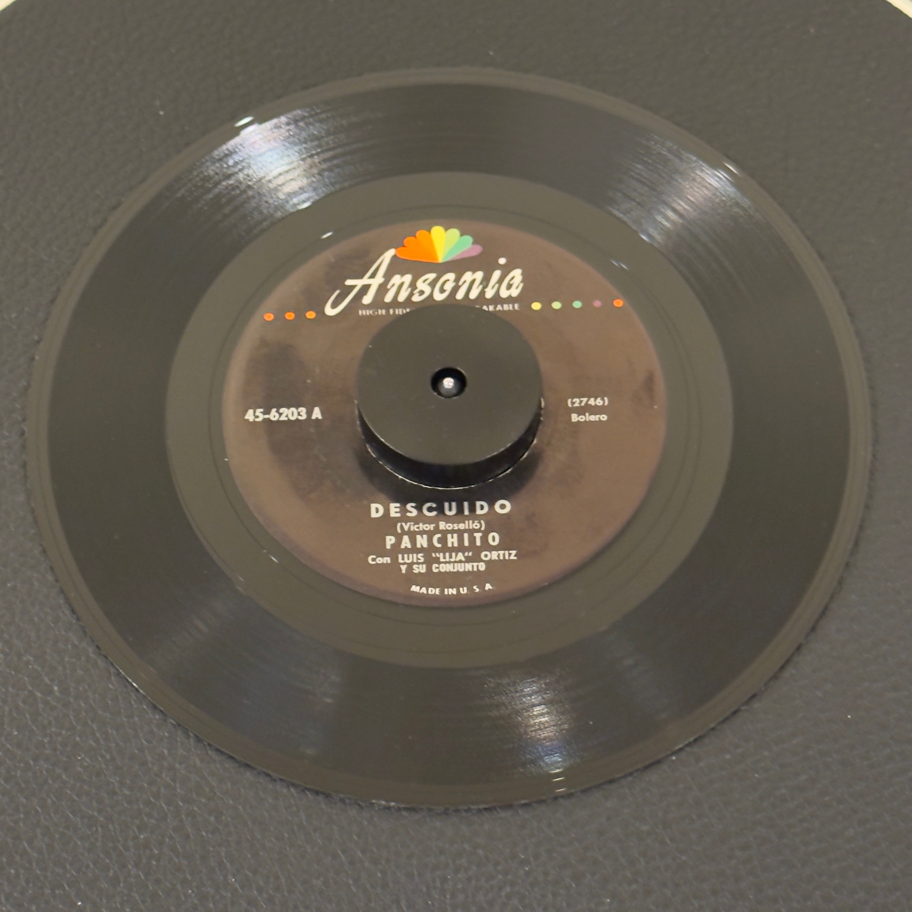 7" vinyl record by Panchito featuring "Descuido/Imploracion", released on Ansonia Records, Inc (45-6203), in VG (Very Good) condition, classic analog collectable for turntable playback. Includes Ansonia sleeve.