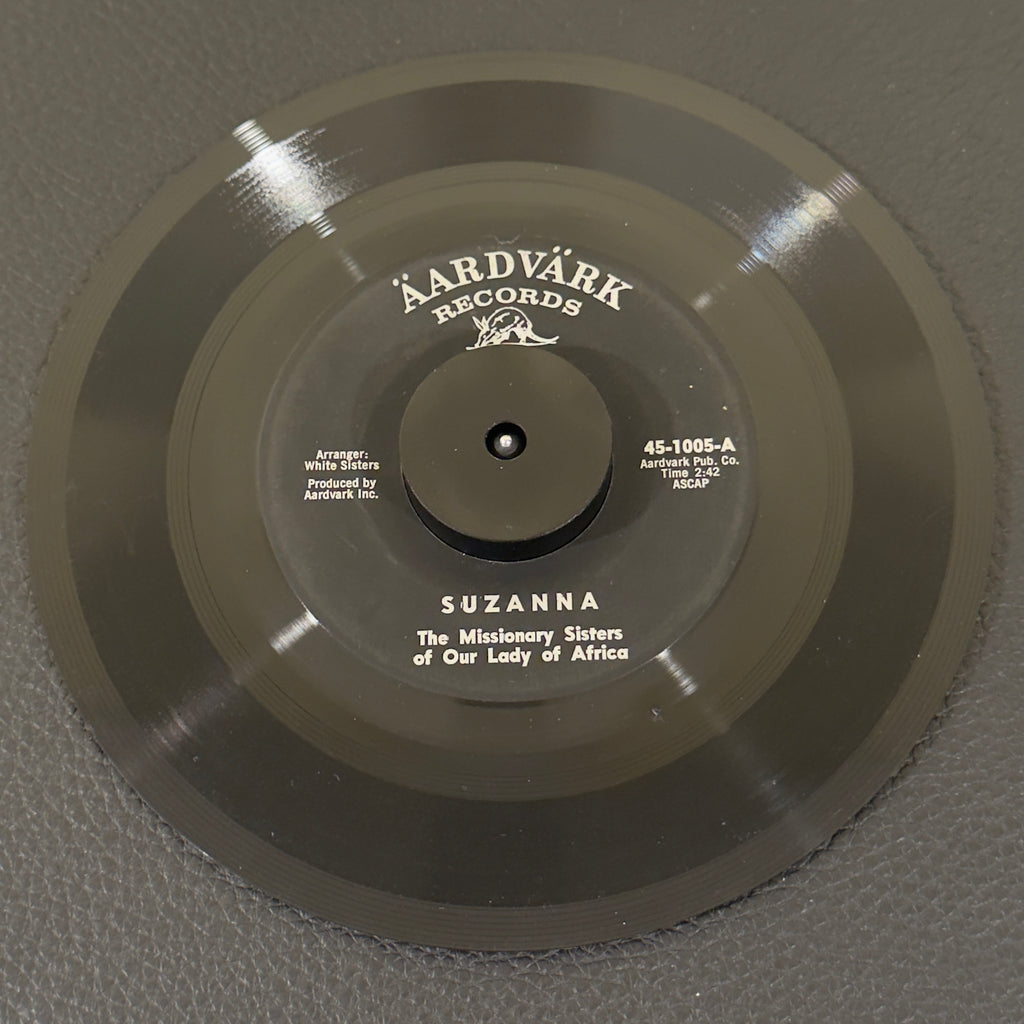 7" vinyl record by Missionary Sisters of Our Lady of Africa featuring "Suzanna/W'Otai Moro", released on Aardvark (45-1005), in G+ (Good Plus) condition, classic analog collectable for turntable playback. Super Rare and authentic gem to add to your vinyl collection!!