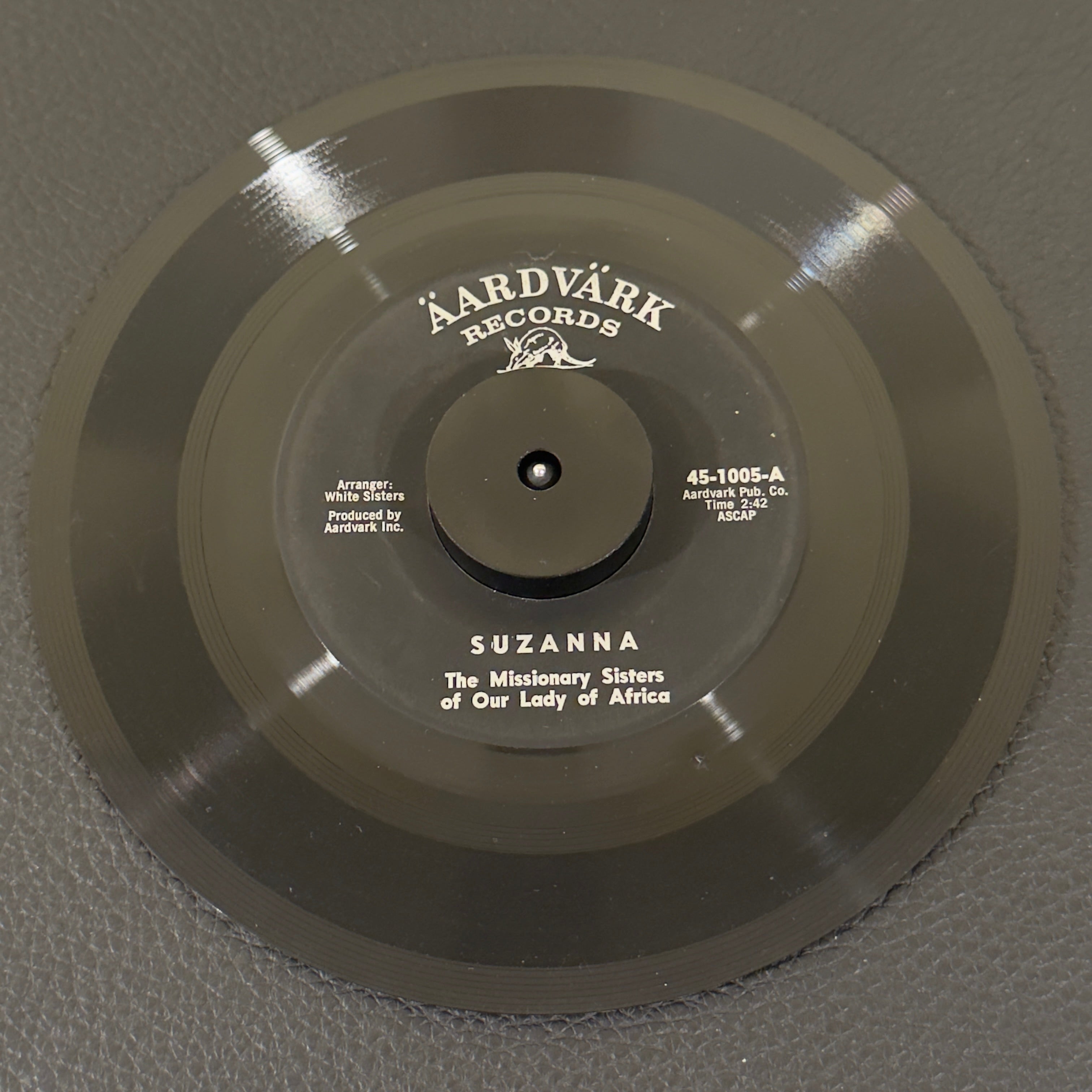7" vinyl record by Missionary Sisters of Our Lady of Africa featuring "Suzanna/W'Otai Moro", released on Aardvark (45-1005), in G+ (Good Plus) condition, classic analog collectable for turntable playback. Super Rare and authentic gem to add to your vinyl collection!!