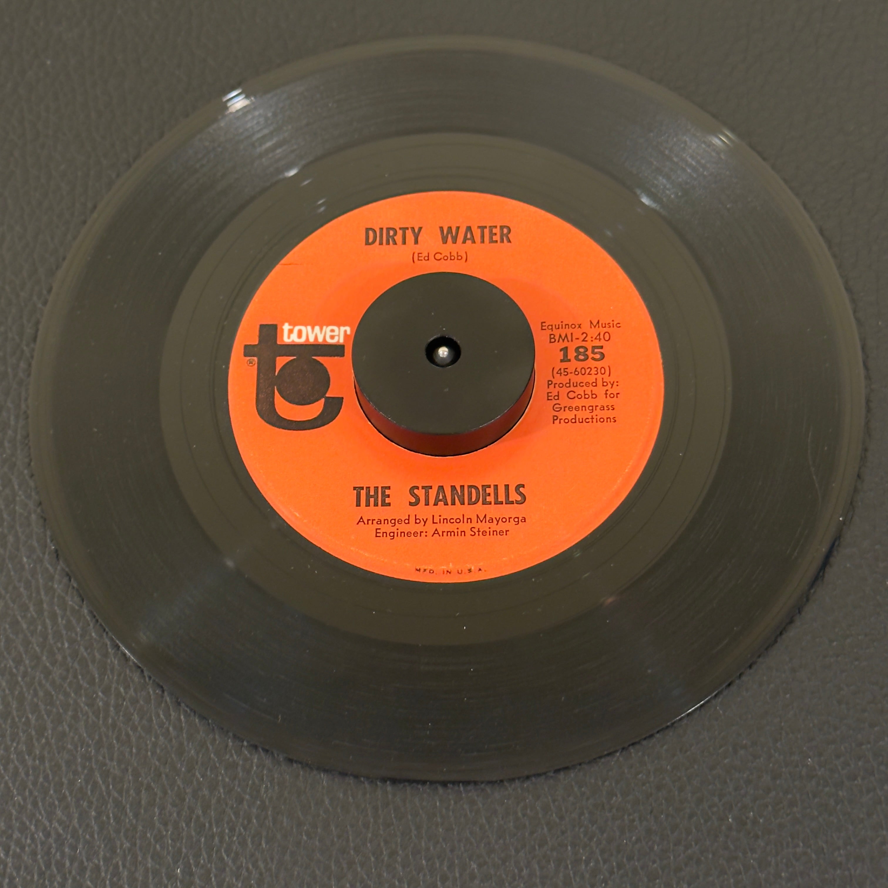 7" vinyl record by Standells, The featuring "Dirty Water/Rari", released on Tower (185), in VG (Very Good) condition, classic analog collectable for turntable playback. Scranton Pressing. Original Tower sleeve included (slight tear at bottom)