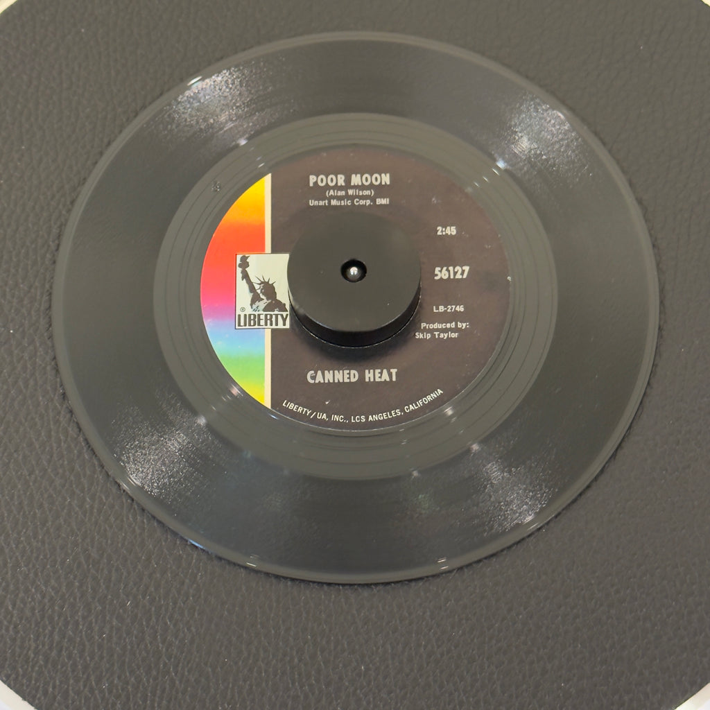 7" vinyl record by Canned Heat featuring "Poor Moon/Sic 'Em Pigs", released on Liberty (56127), in VG (Very Good) condition, classic analog collectable for turntable playback. Includes original Liberty sleeve.
