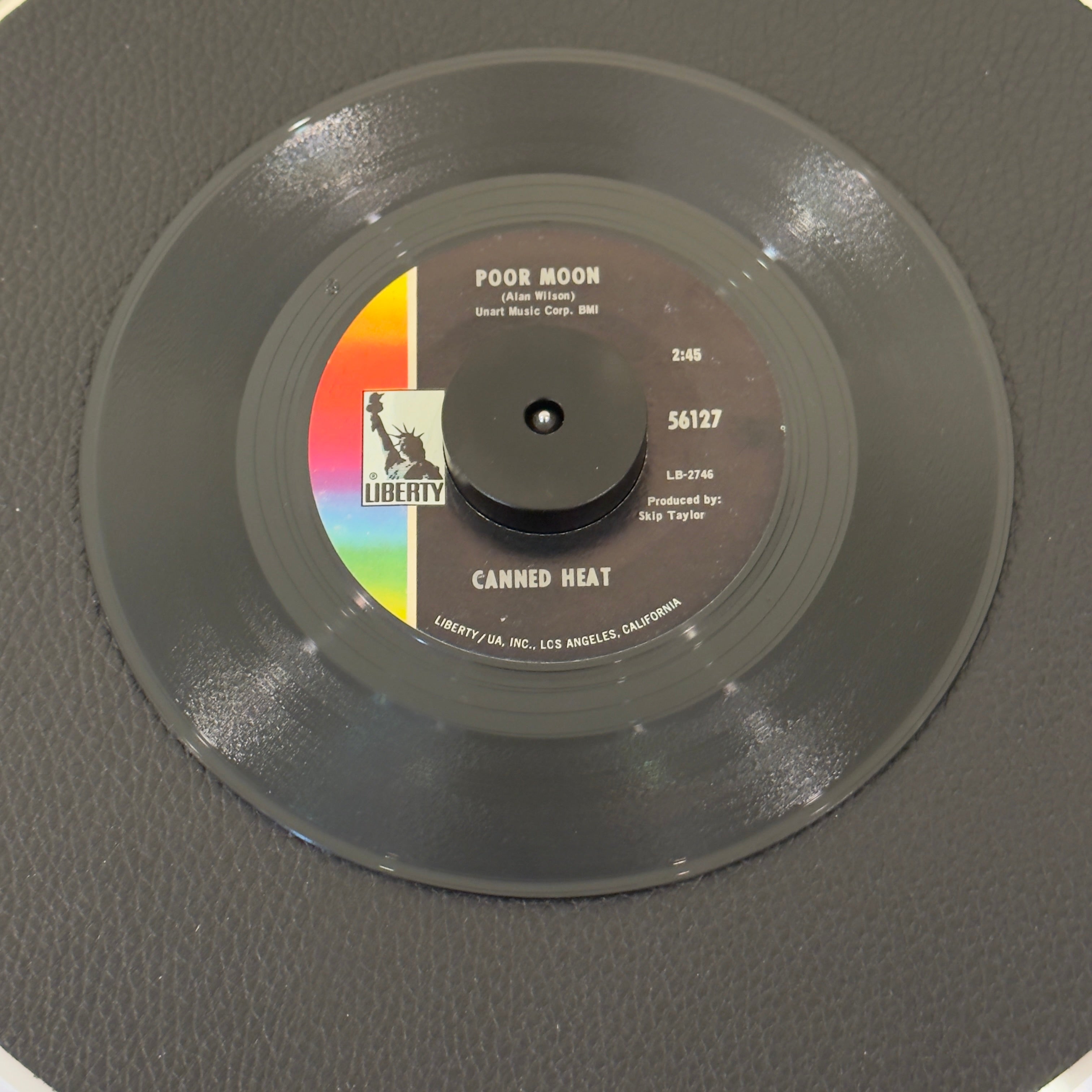 7" vinyl record by Canned Heat featuring "Poor Moon/Sic 'Em Pigs", released on Liberty (56127), in VG (Very Good) condition, classic analog collectable for turntable playback. Includes original Liberty sleeve.