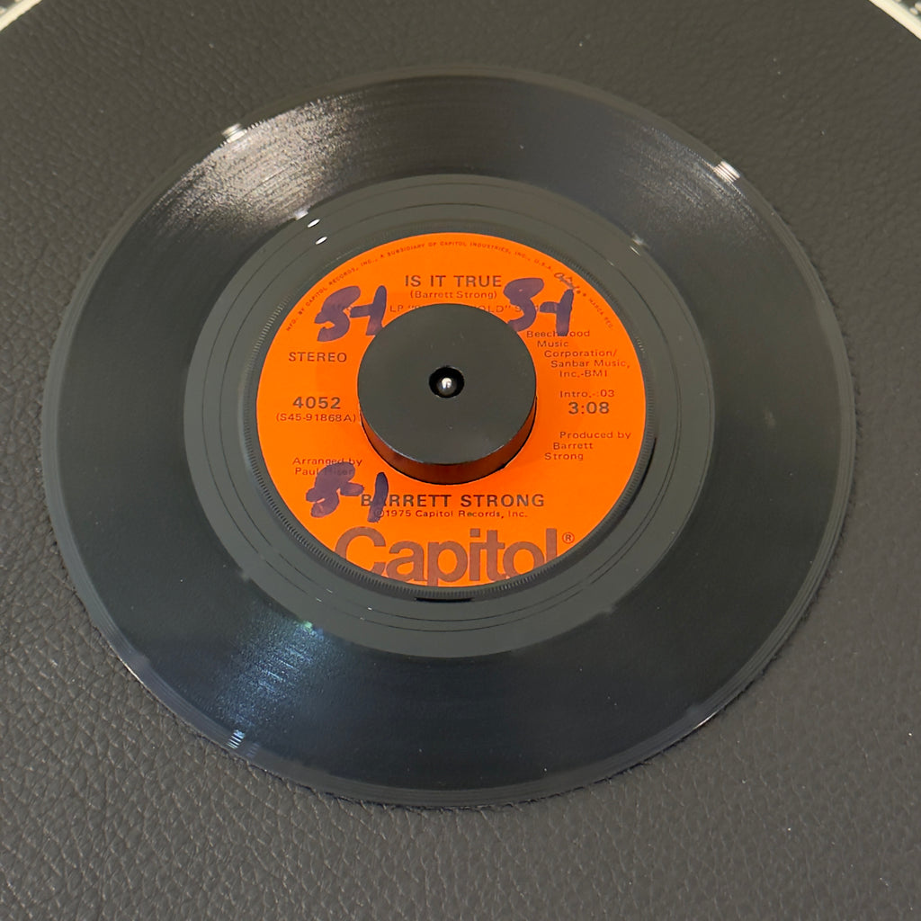 7" vinyl record by Barrett Strong featuring "Is It True/Anywhere", released on Capitol Records (4052), in VG+ (Very Good Plus) condition, classic analog collectable for turntable playback. Rare orange label!  Includes original Capitol sleeve.  Writing on one side of label.
