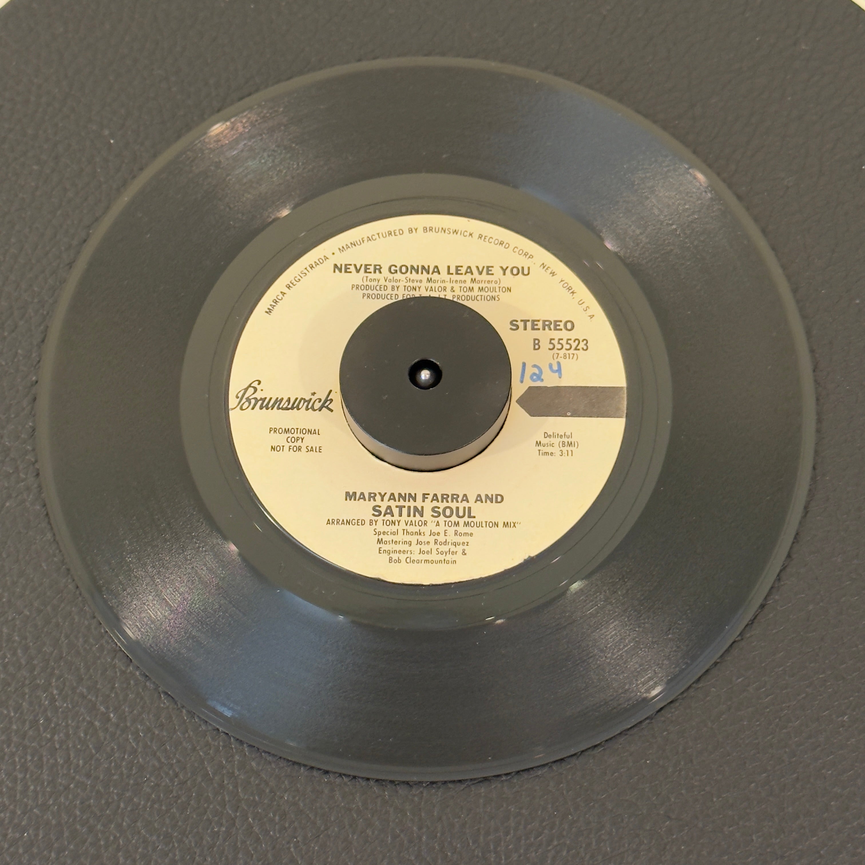 7" vinyl record by Maryann Farra &  Satin Soul featuring "Never Gonna Leave You (Stereo/Mono)", released on Brunswick (B 55523), in VG+ (Very Good Plus) condition, classic analog collectable for turntable playback. Promotional Copy. Slight writing on both sides of label.