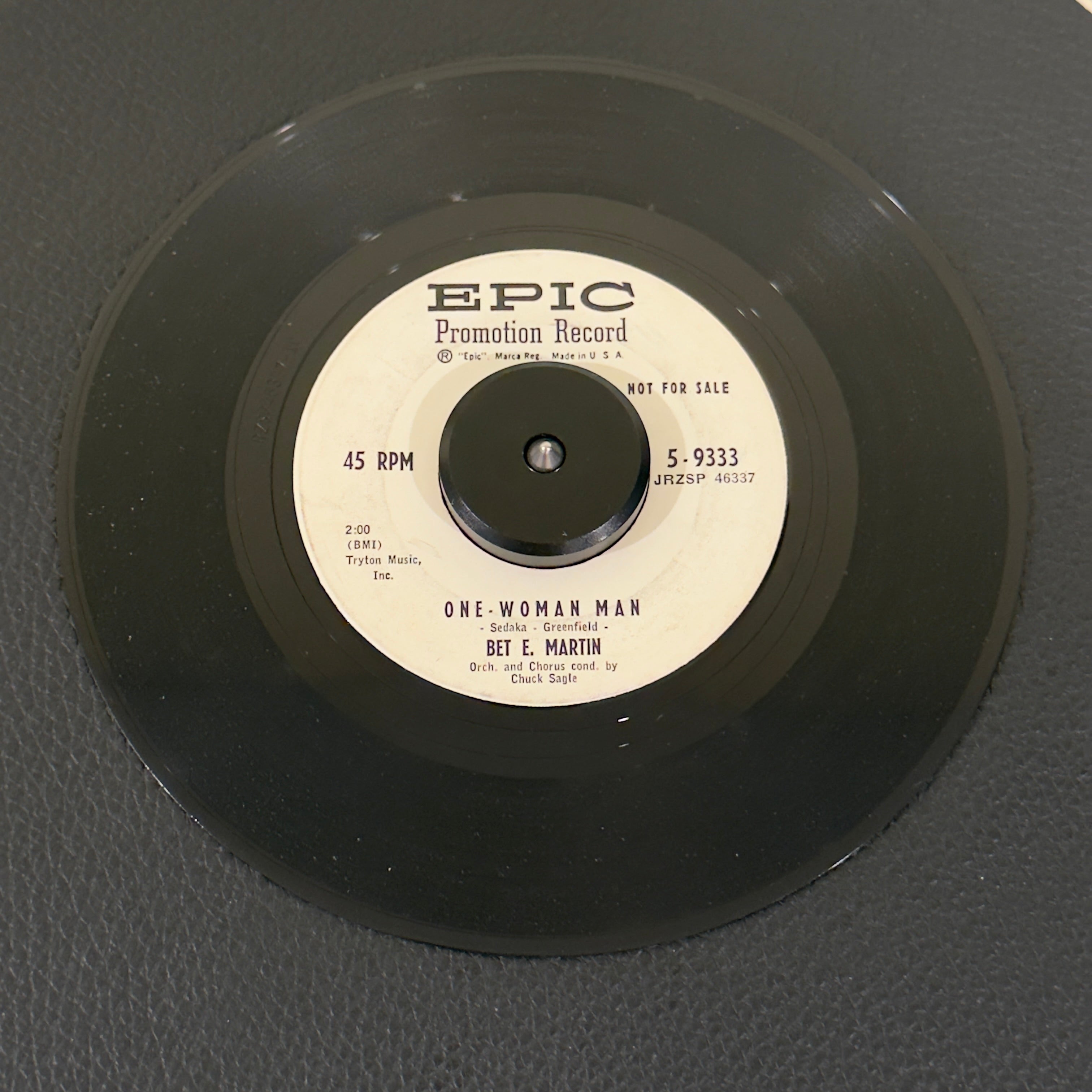 7" vinyl record by Bet E. Martin featuring "One-Woman Man/Maybe You'll Be There", released on Epic (5-9333), in VG (Very Good) condition, classic analog collectable for turntable playback. Vintage 1959 Rock Promo in generic white sleeve.