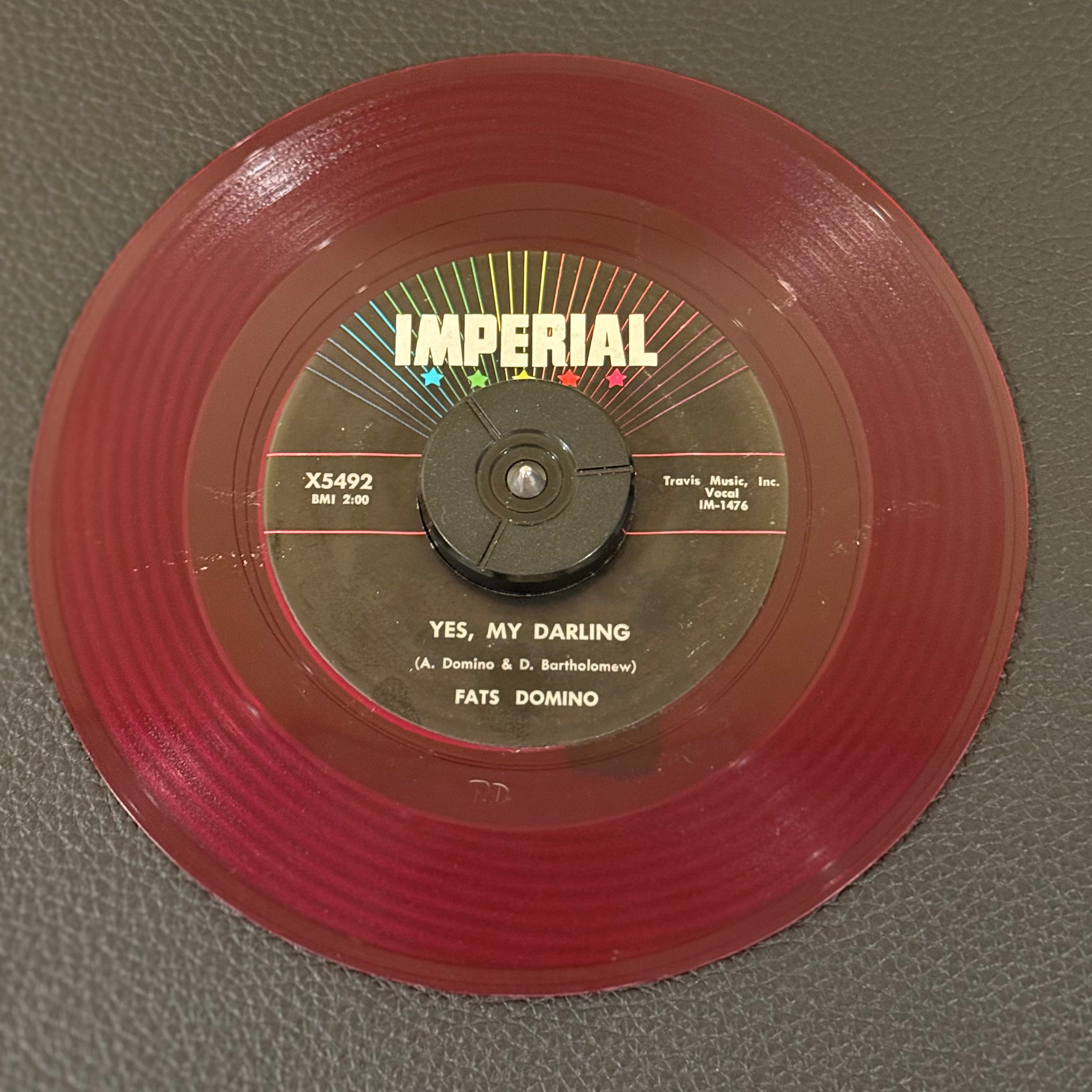 7" vinyl record by Fats Domino featuring "Yes, My Darling/Don't You Know I Love You", released on Imperial (X5492), in VG (Very Good) condition, classic analog collectable for turntable playback. Red Vinyl.