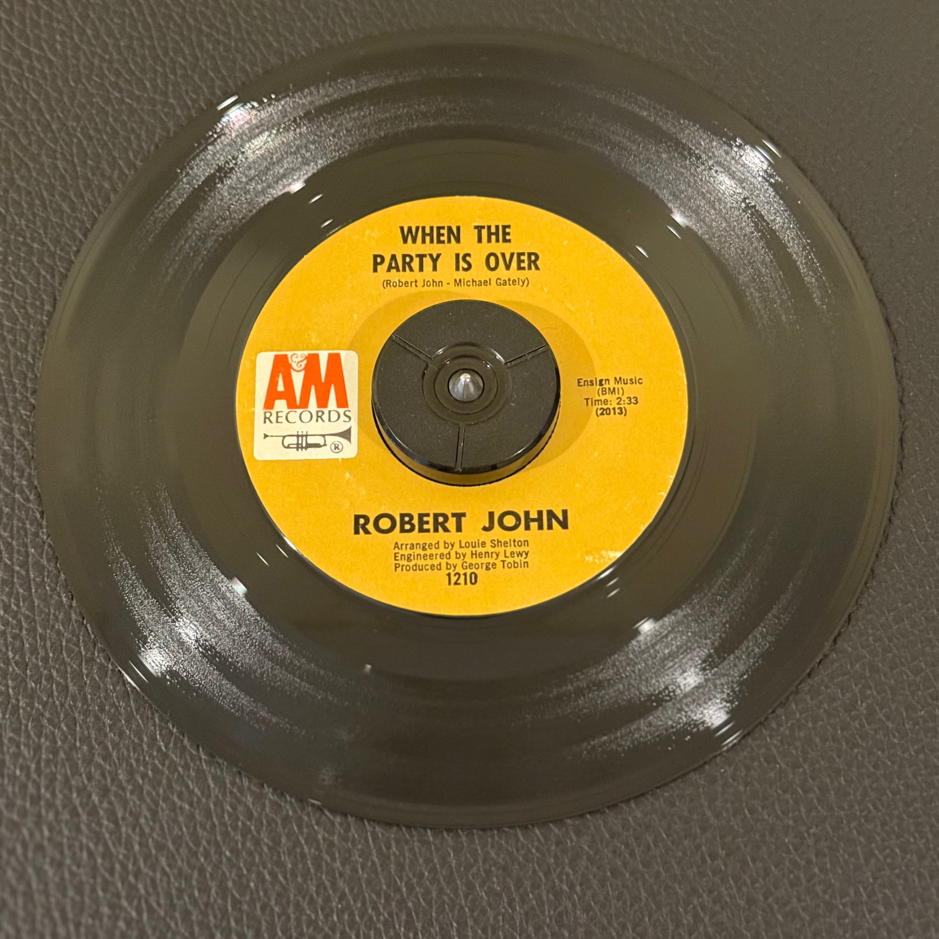 7" vinyl record by Robert John featuring "When The Party Is Over/Raindrops, Love and Sunshine", released on A&M Records (1210), in VG+ (Very Good Plus) condition, classic analog collectable for turntable playback. Monarch Pressing.