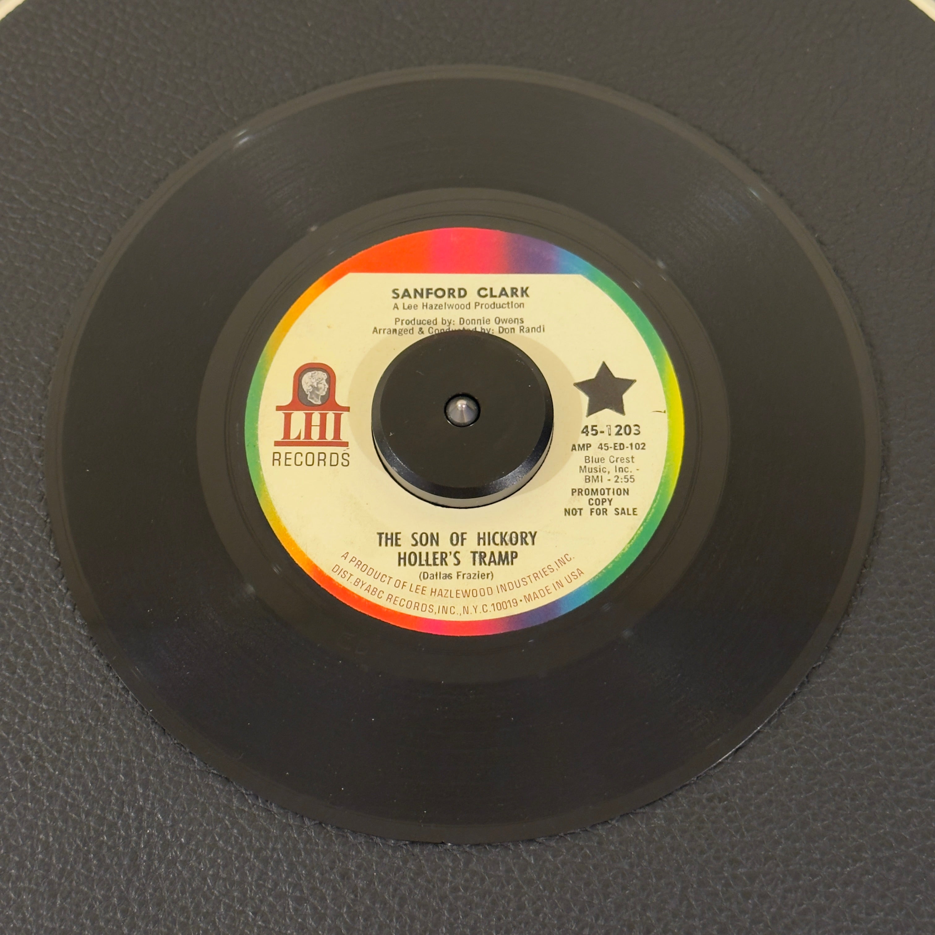 7" vinyl record by Sanford Clark featuring "The Son Of Hickory Hollers Tramp/The Black Widow Spider", released on LHI Records (45-1203), in VG+ (Very Good Plus) condition, classic analog collectable for turntable playback. Promotional copy! Includes the highly sought after cult classic "The Black Widow Spider".