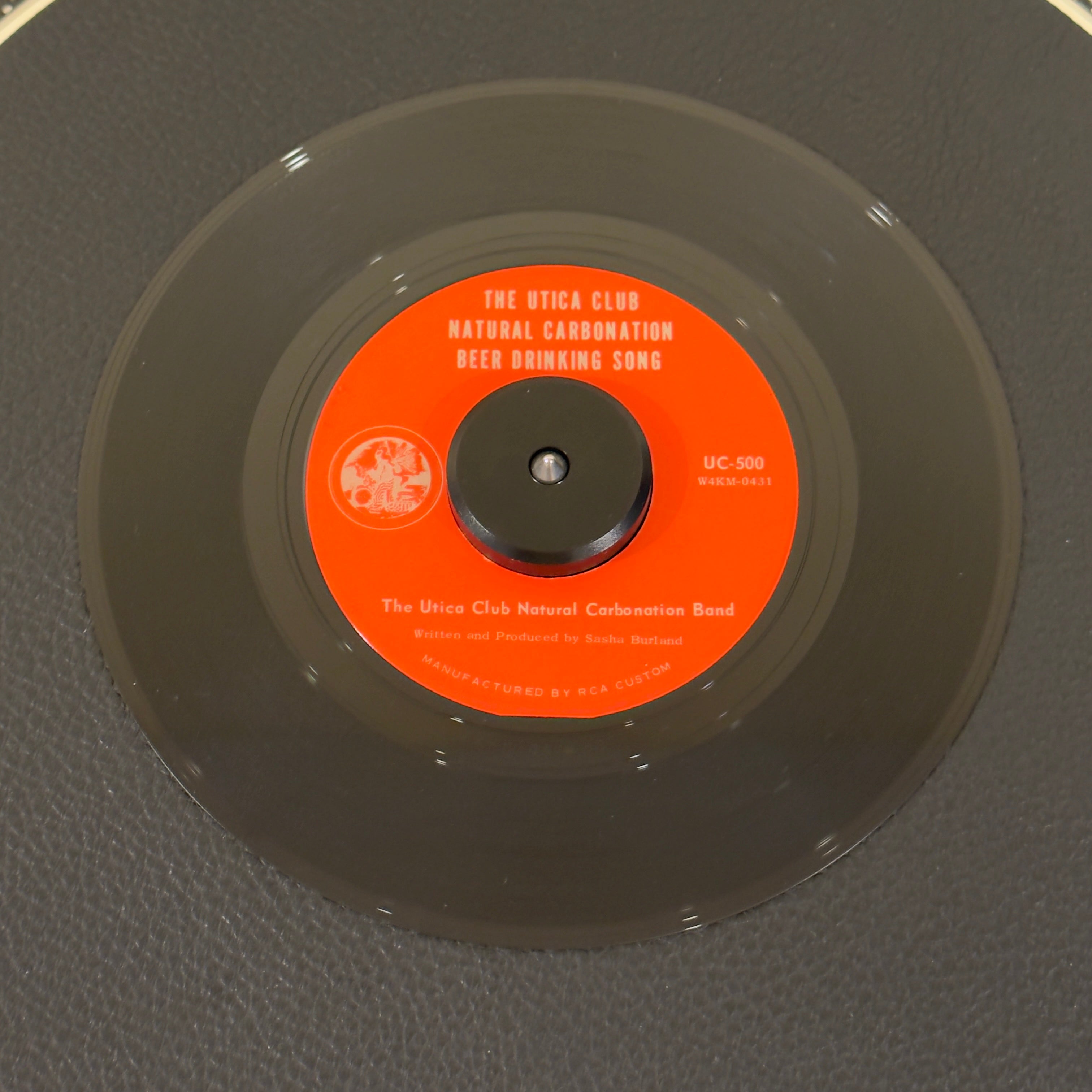 7" vinyl record by Utica Club Natural Carbonation Band featuring "The UTCNCB Drinking Song/Natural Carbonation", released on Utica Club Beer (UC-500), in NM (Near Mint) condition, classic analog collectable for turntable playback. This rare record was given away in limited quantities to visitors touring the Matt Brewing Co. in 1968.